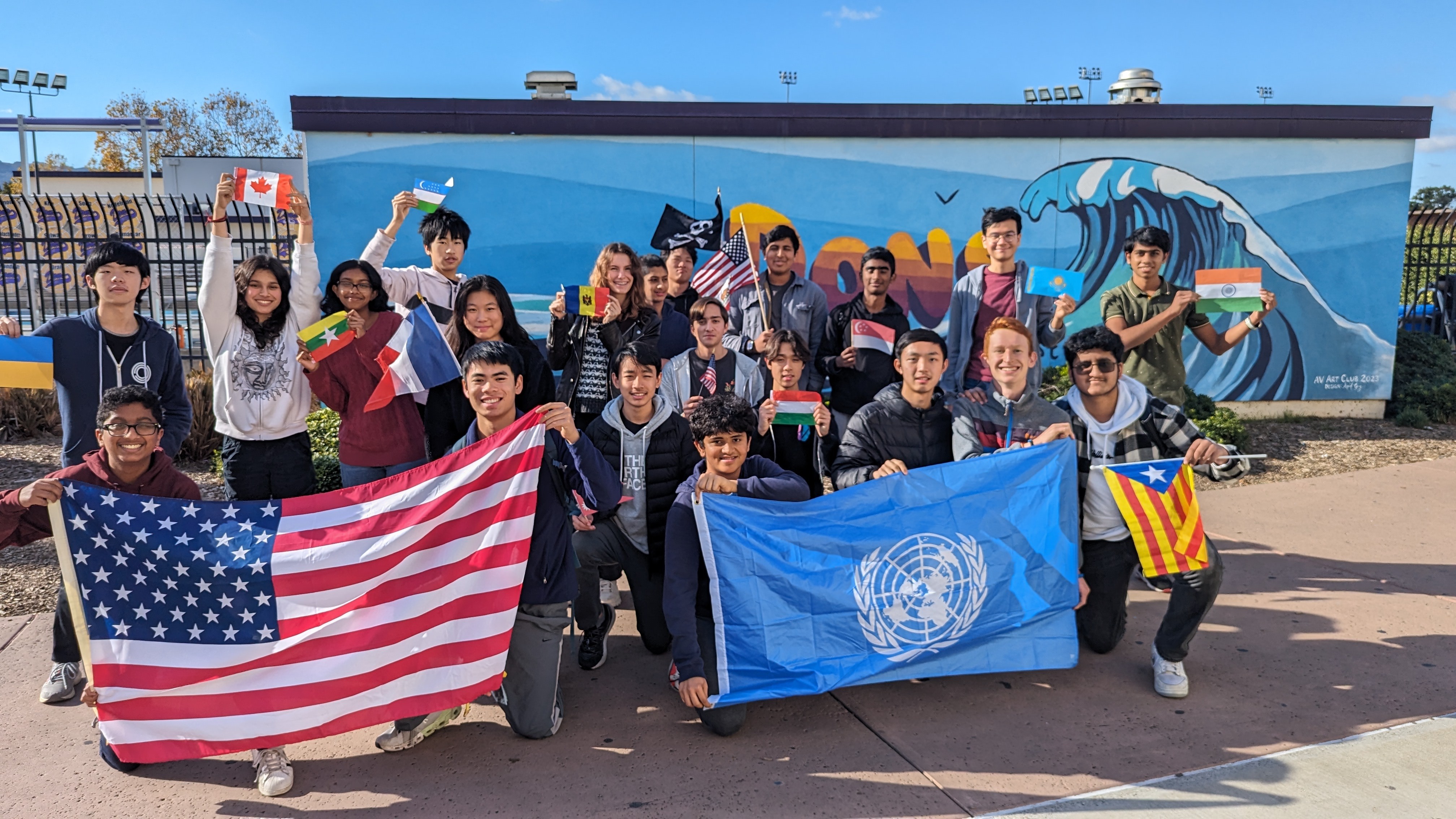 Members of the AV Geo Club posing with flags
